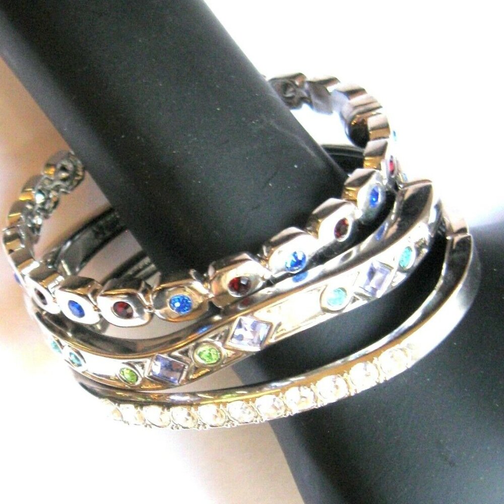Jeweled Silvertone Hinged Bangle Bracelets adorned with colorful Crystals.